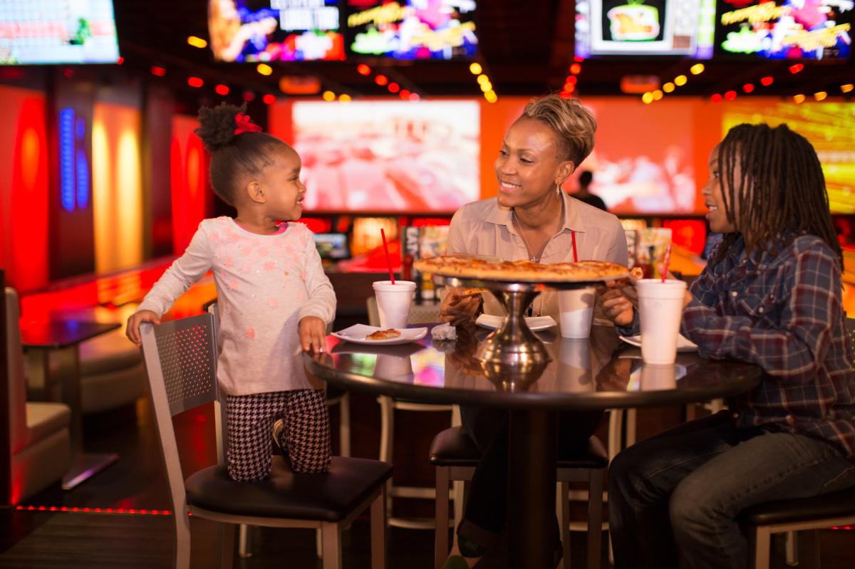 Family eating pizza at Andy B's