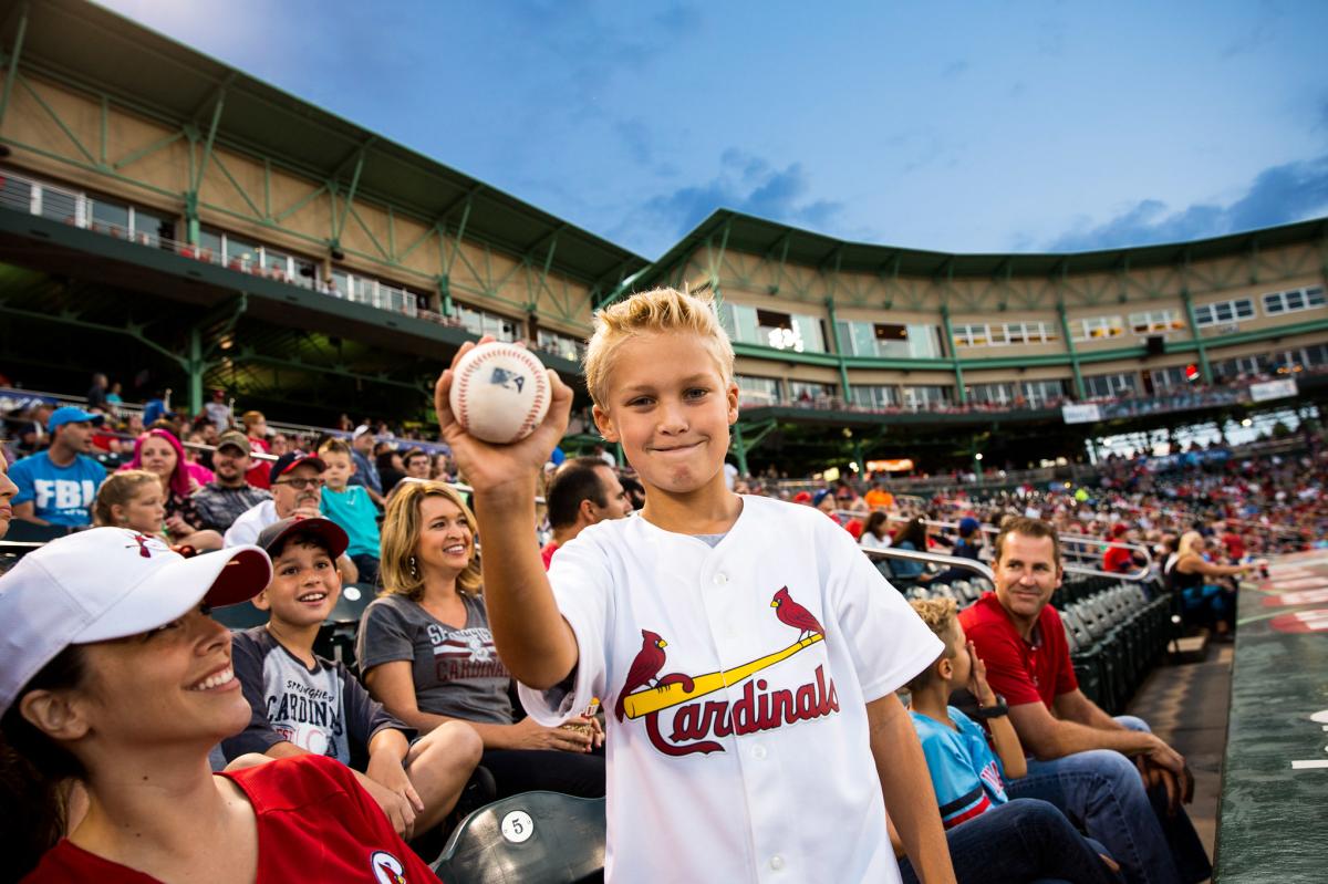 Boy holding baseball at Springfield Cardinals Game