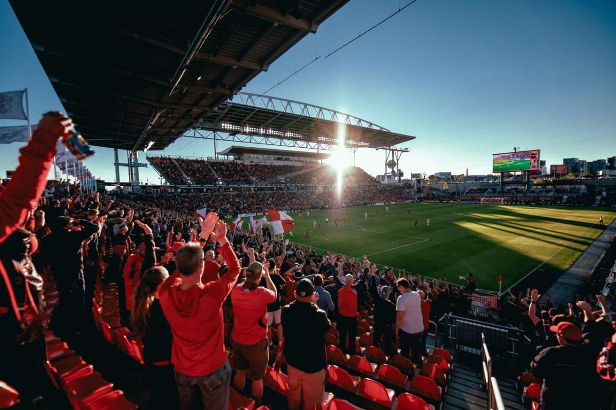 Fans cheering at BMO field at sunset