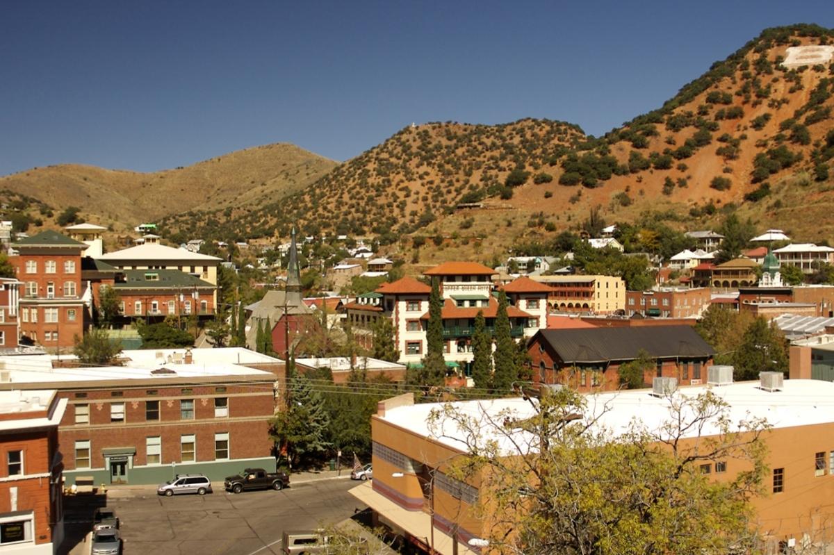 Aerial view of a small town on a hill with historic brick buildings