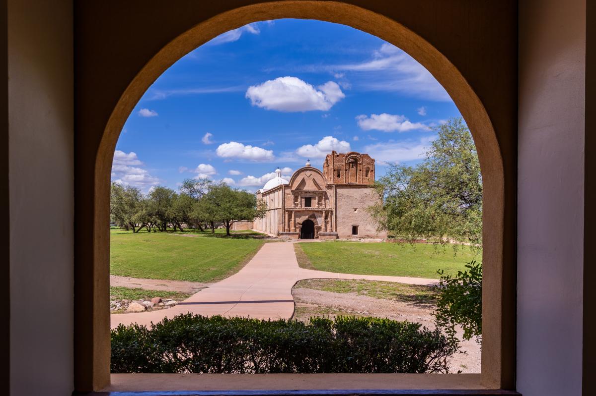 a lone, old Spanish building in a field