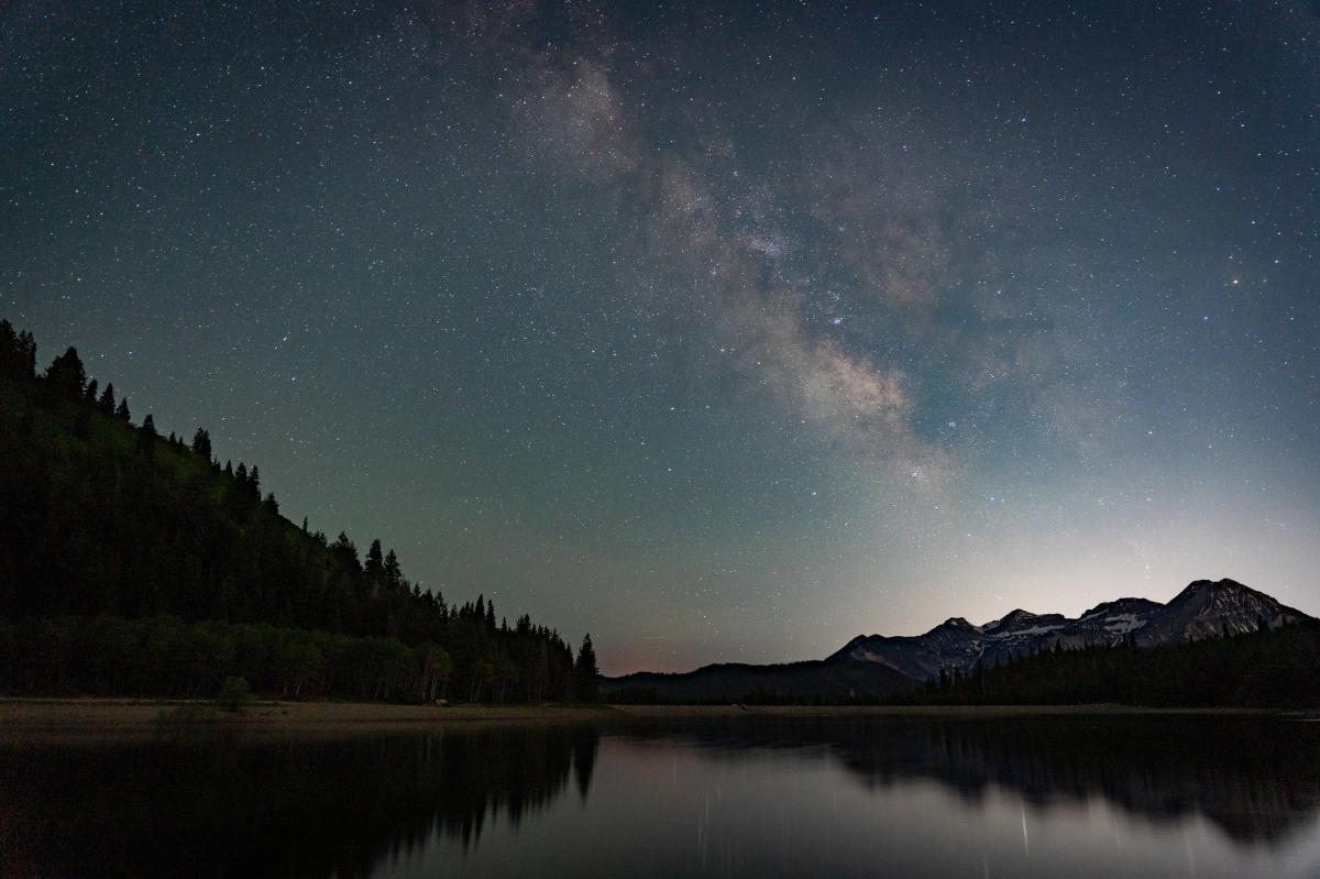 Silver Lake reflecting the night's sky with mount timpanogos in the background