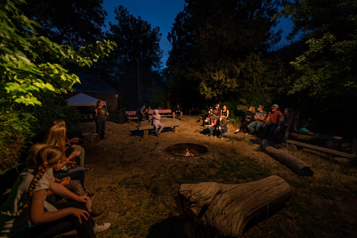 Visitors gathered around a fire at Thompson Century Farm