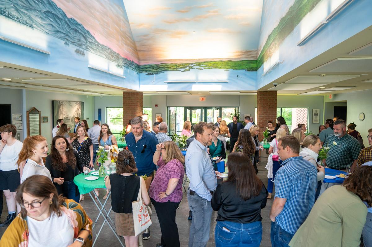 An indoor networking event taking place at Main Street Landing's Lake Lobby.