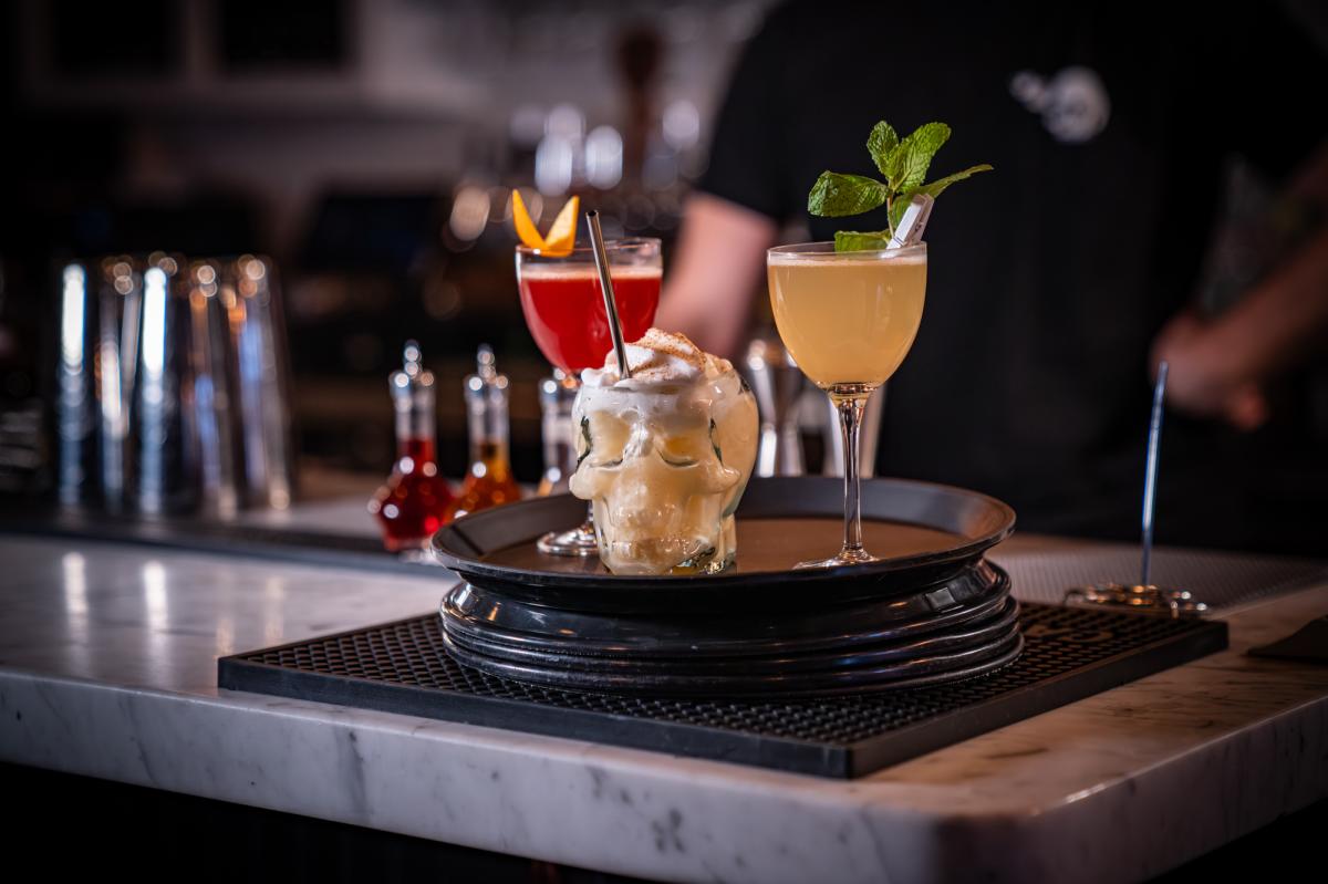 Three drinks on a tray at Devil Takes a Holiday