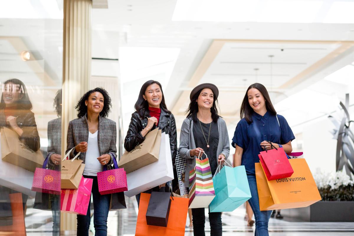 Female shoppers smile at the King of Prussia mall