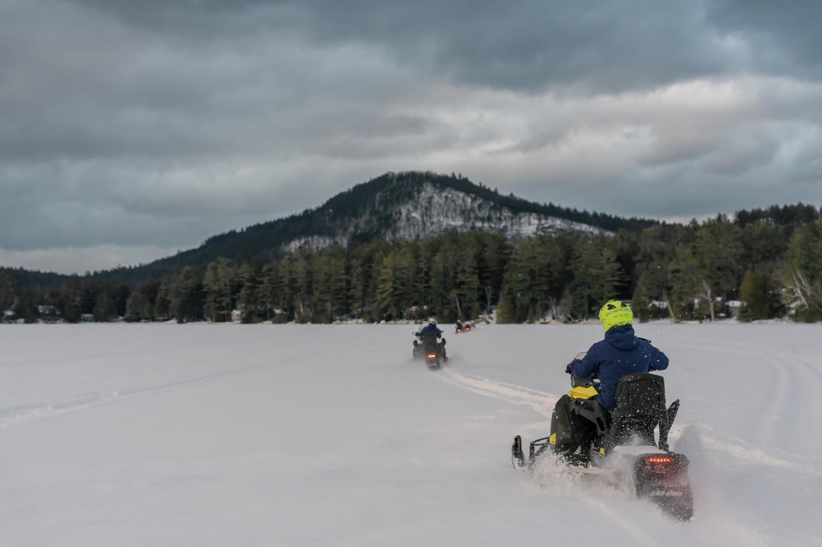 A group of snowmobiles on Loon Lake