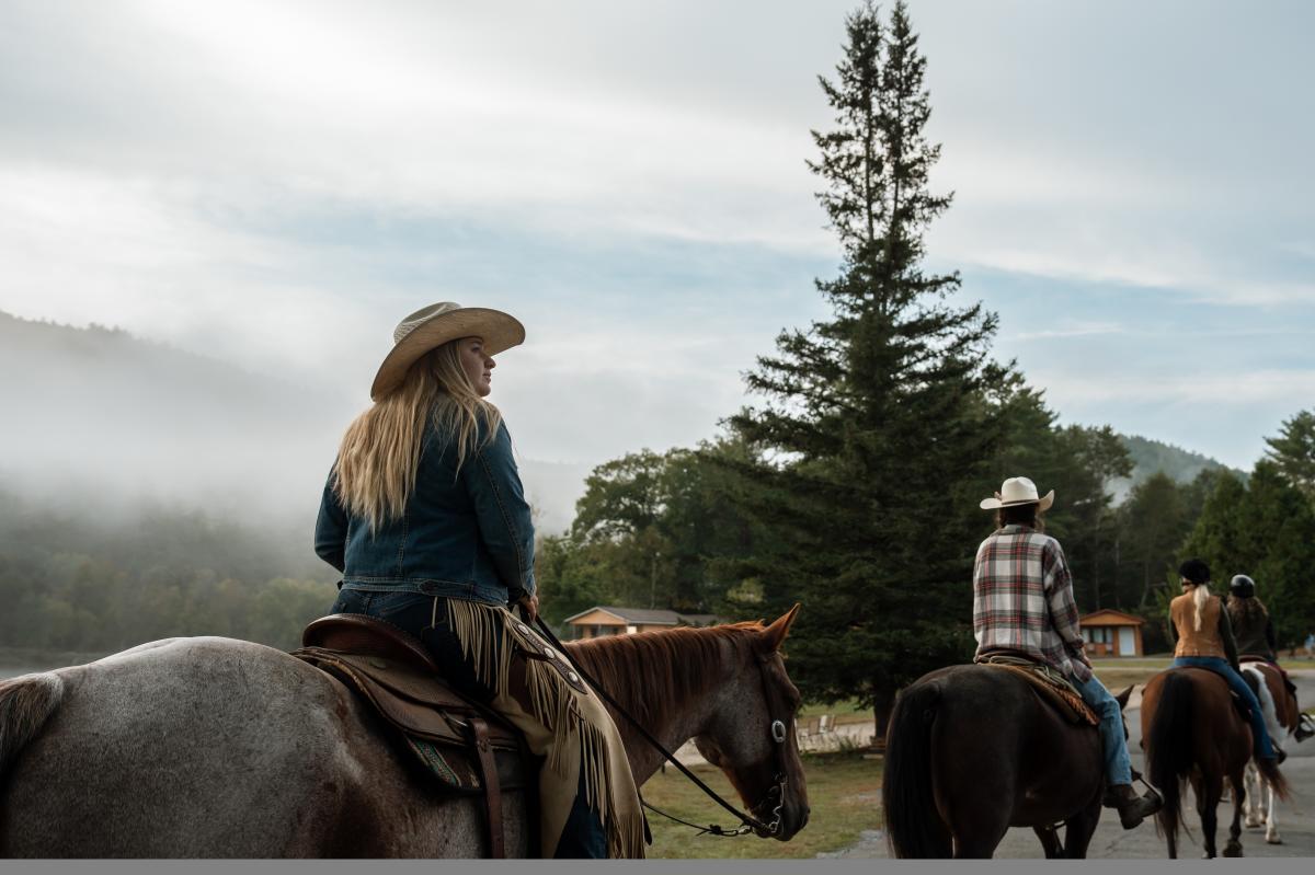 Women horseback riding at 1000 Acres Ranch