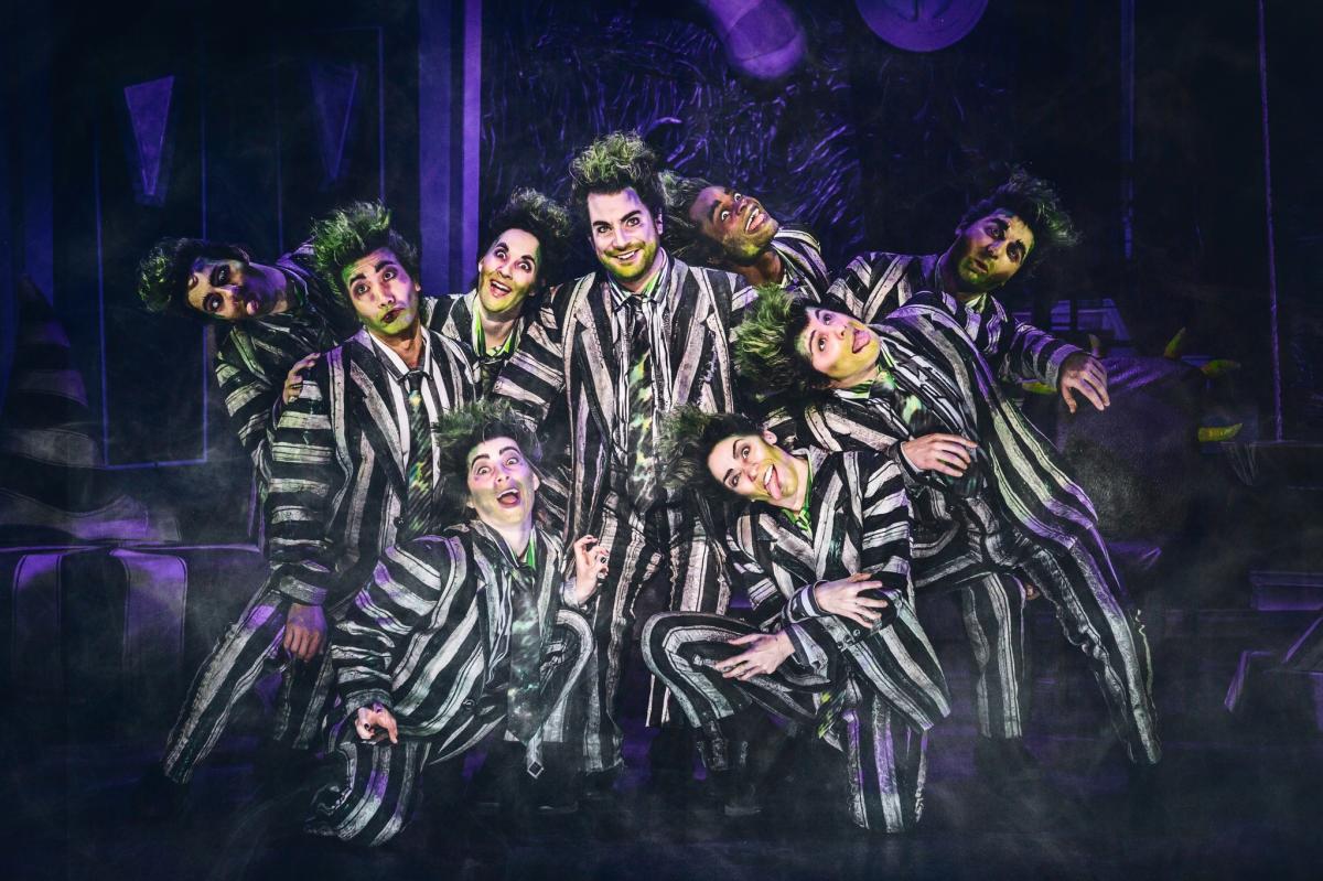 Actors dress as the character Beetlejuice during a scene of the Broadway Musical