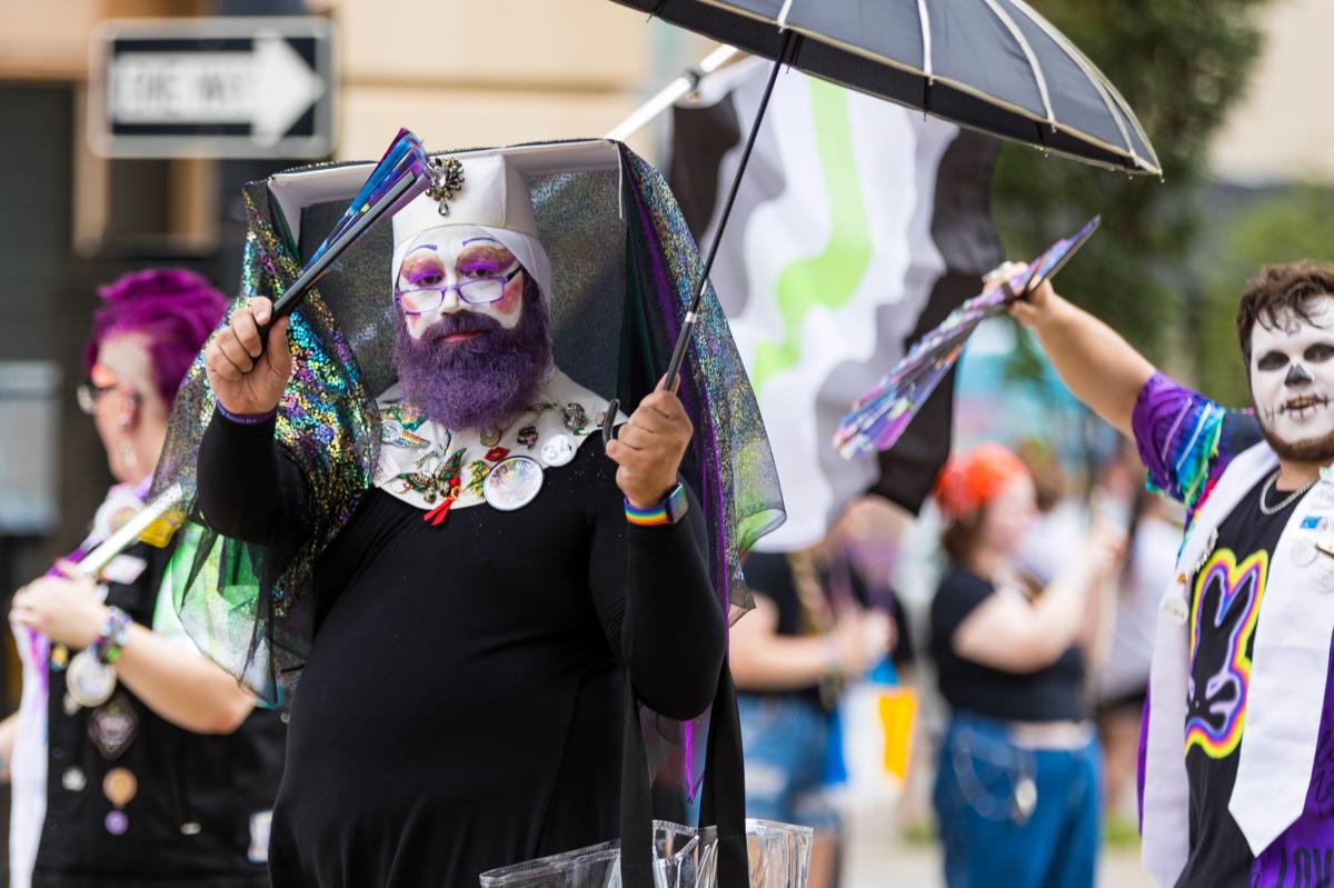 A member of the Emerald City Sisters walks through the Wichita Pride Parade