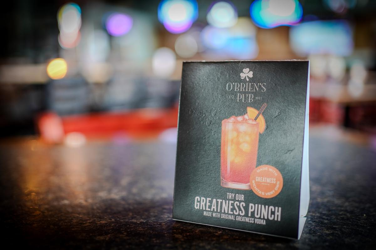A card displays a cocktail made with Greatness Vodka at O'Brien's Pub