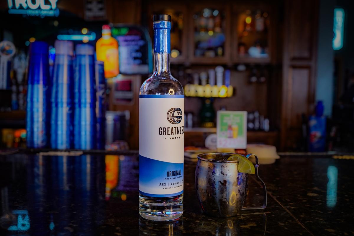 A bottle of Greatness Vodka rests on top of a bar in Wichita