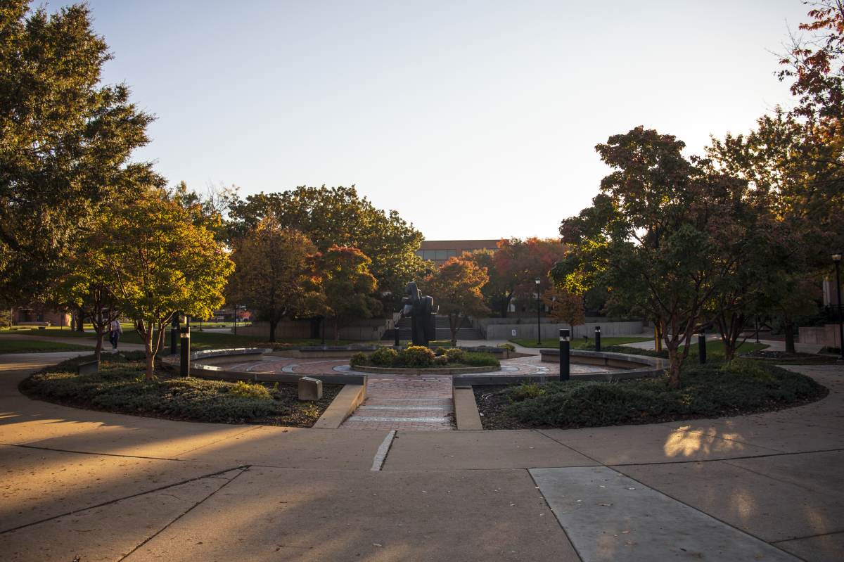 Students walk across the Wichita State University campus in the fall