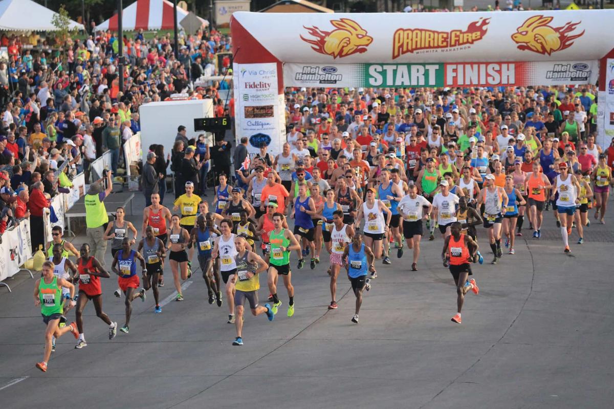 The Prairie Fire Marathon begins with a large number of runners leaving the starting line