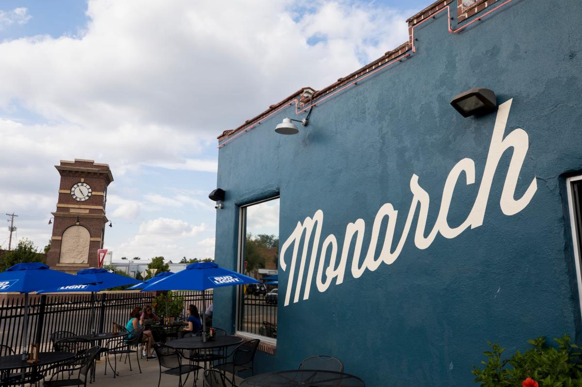 Photo of the Monarch's patio and side of building with the Delano clock tower in the background