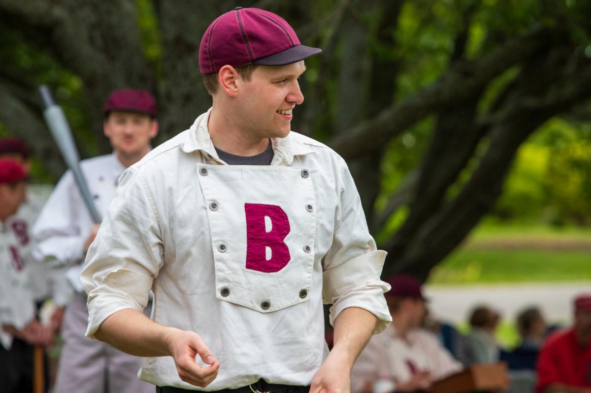 a man is dressed in vintage baseball gear to play a vintage baseball game at Old Cowtown Museum.
