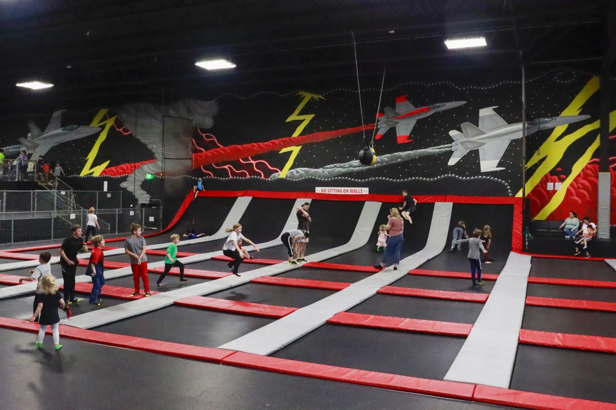 People bounce on tramponlines at Wichita Sports Forum