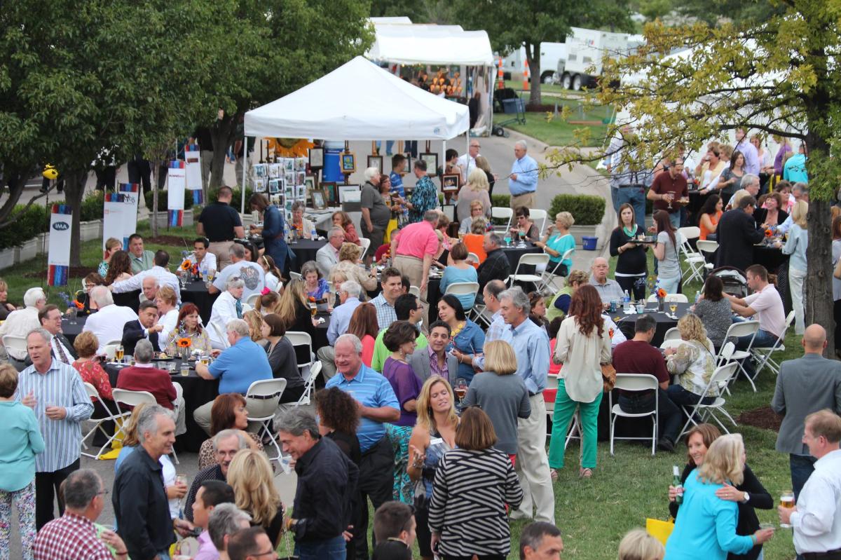 Visitors at the Autumn & Art festival walk through art displays