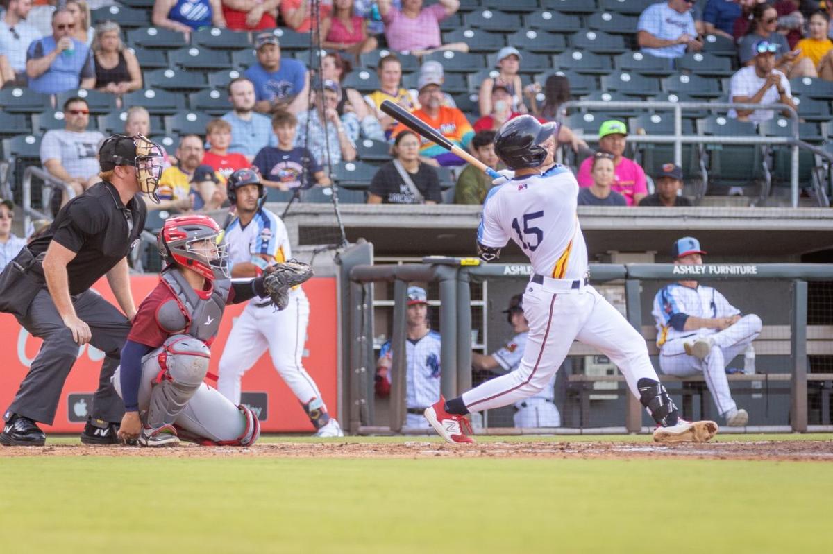 A Wichita Wind Surge player swing at a ball during a game.