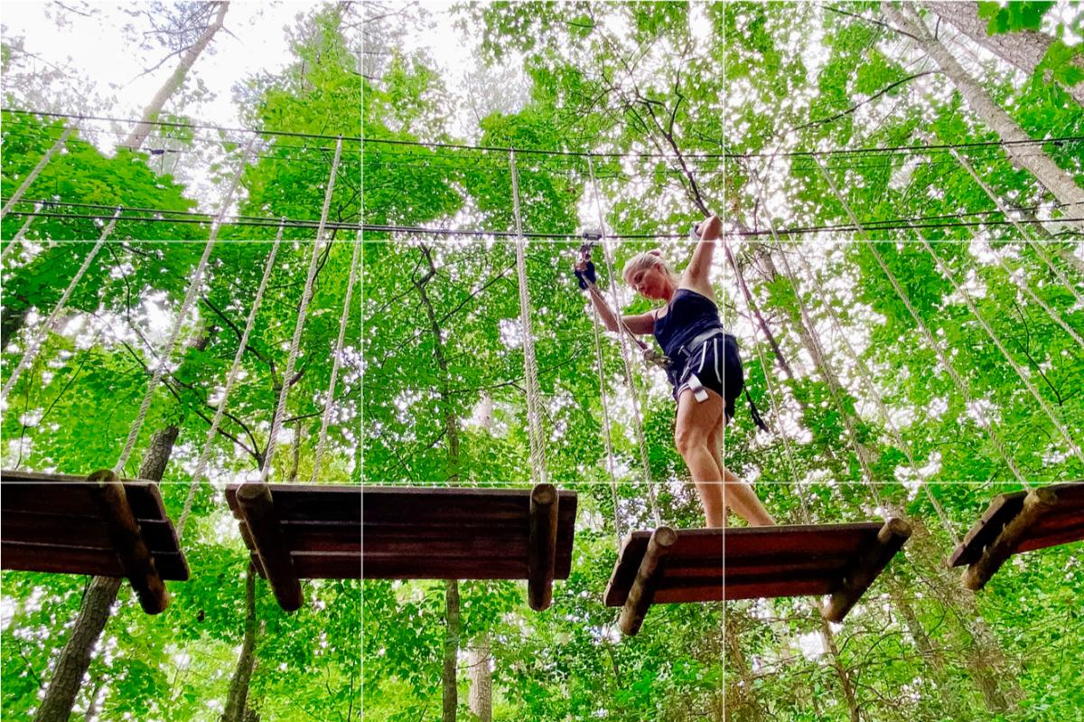 Woman on a high ropes course