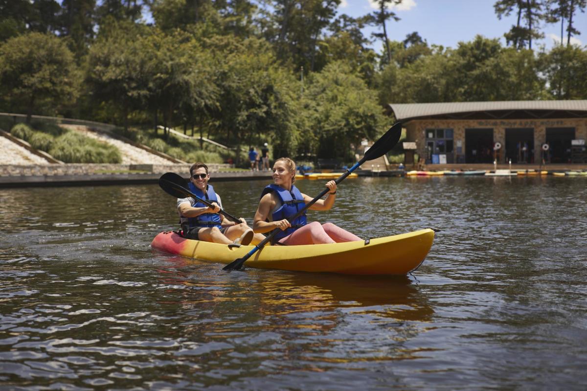 Couple kayaking on The Woodlands Waterway in The Woodlands, Texas