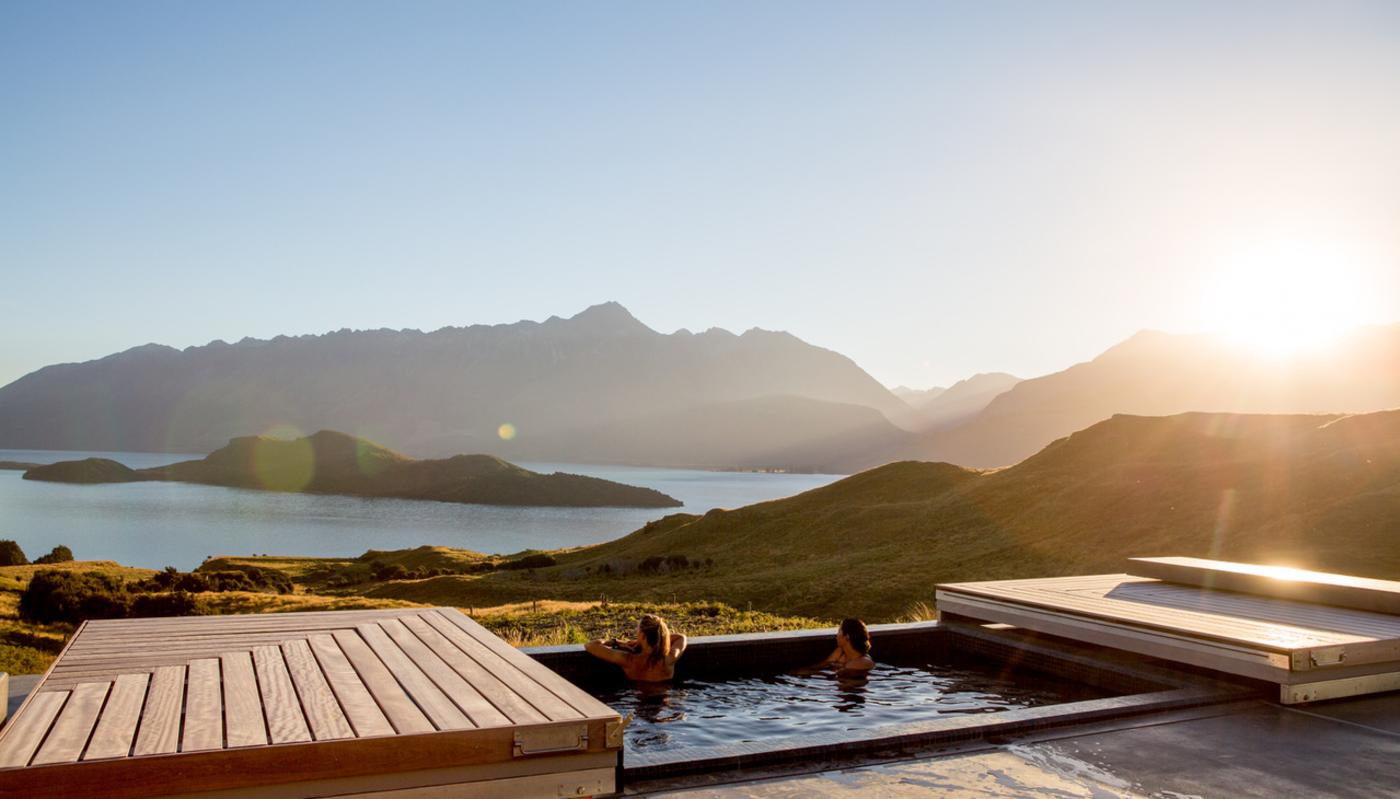 Two women relaxing in the outdoor spa at Aro Ha Wellness Retreat