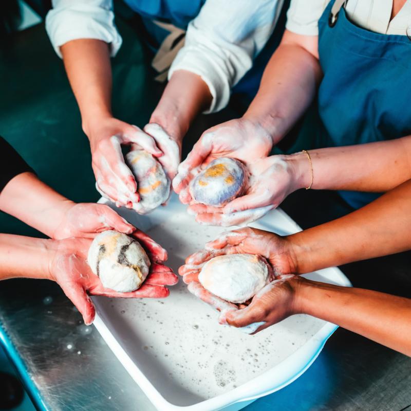 People creating soap souvenirs