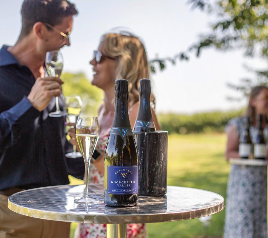A couple enjoying a glass of wine at Woodchester Valley Vineyard