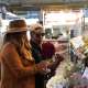 Two people shop for flowers at the North Market
