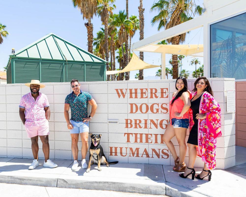 Group and dog in front of Boozehounds