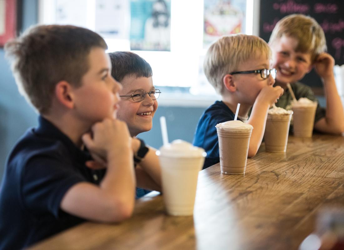 Village Burger Kids Drinking Milkshakes