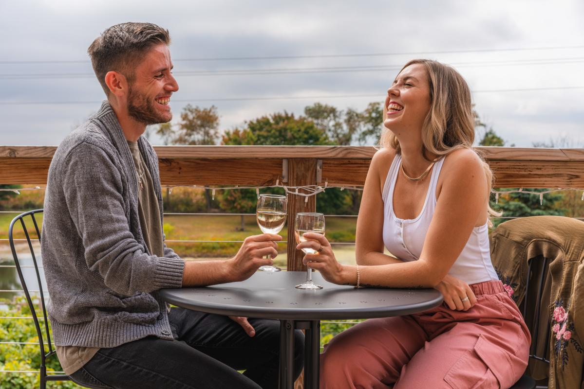 Man and woman cheers glasses at Winery at the Long Shot Farm-17