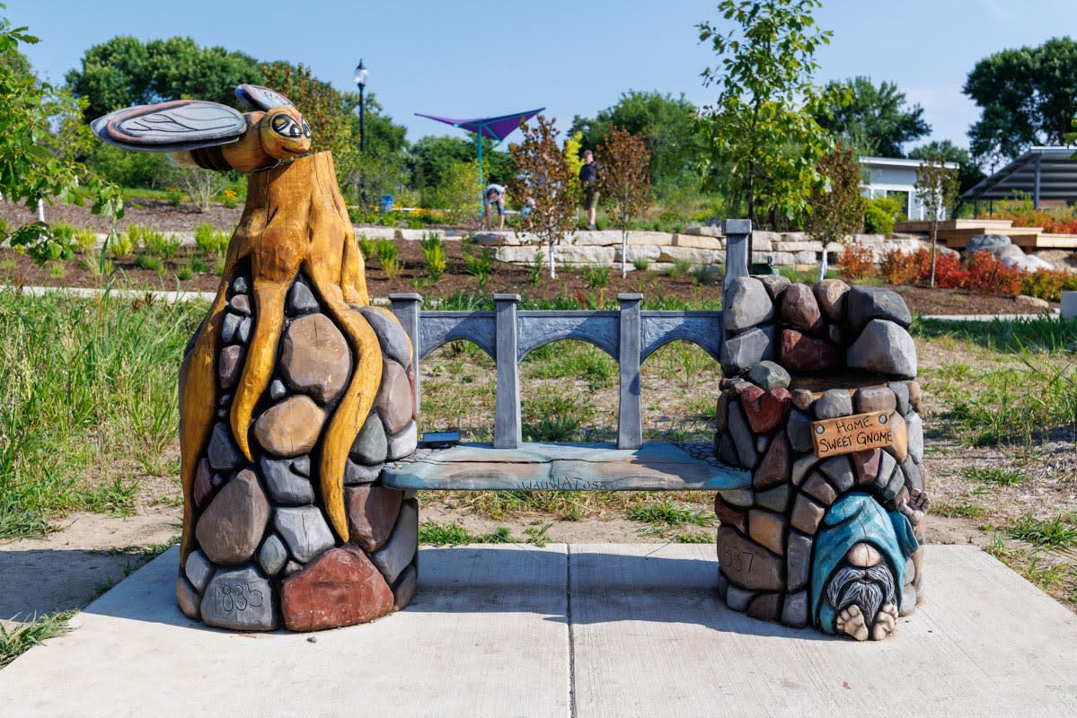 Carved Bench with gnome and dragonfly