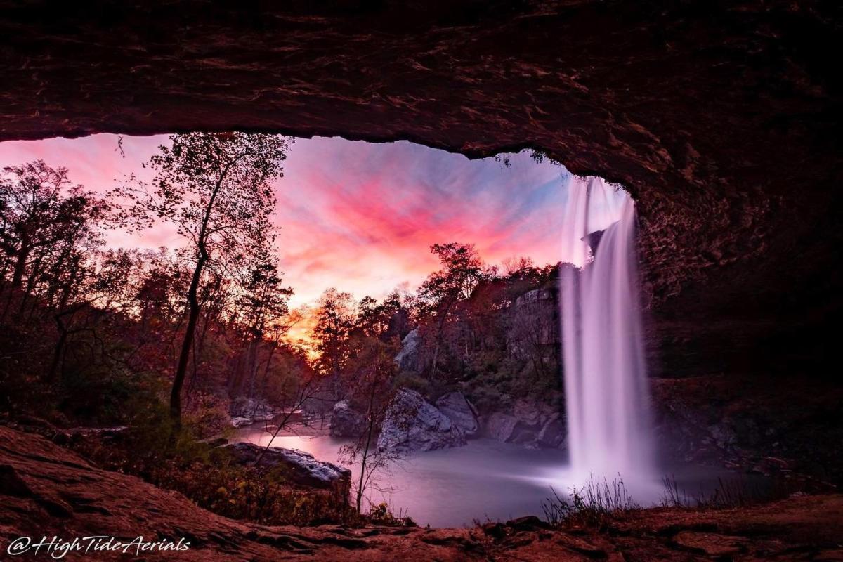noccalula falls sunset from behind the waterfall