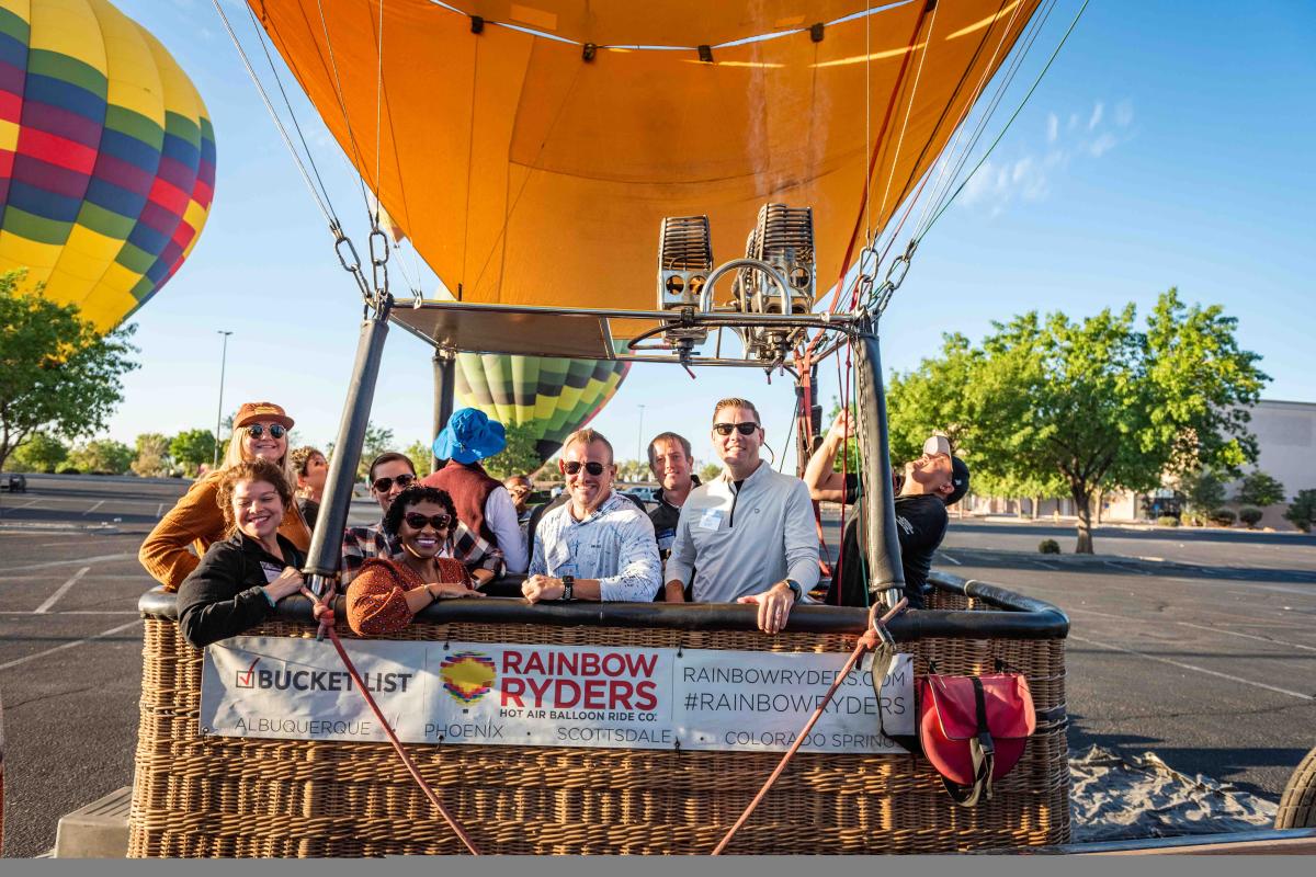 Attendees of the PFA conference FAM inside a hot air balloon basket