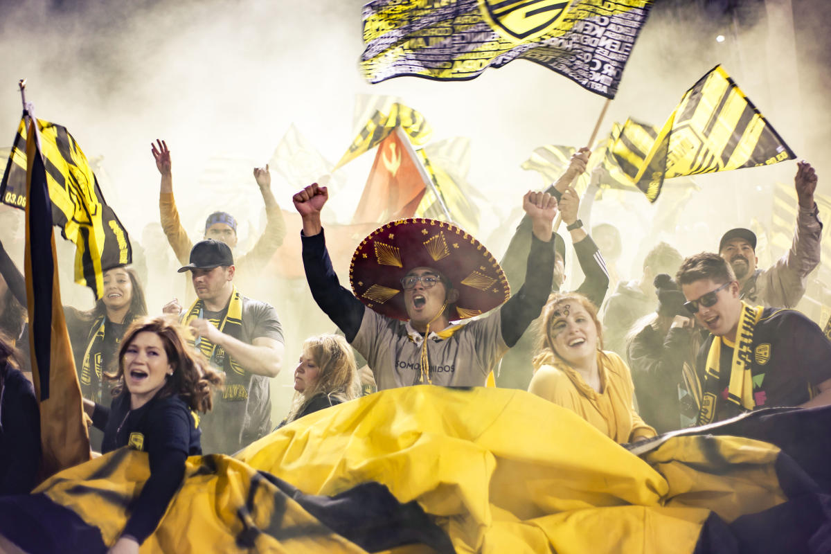 New Mexico United fans cheer during a game