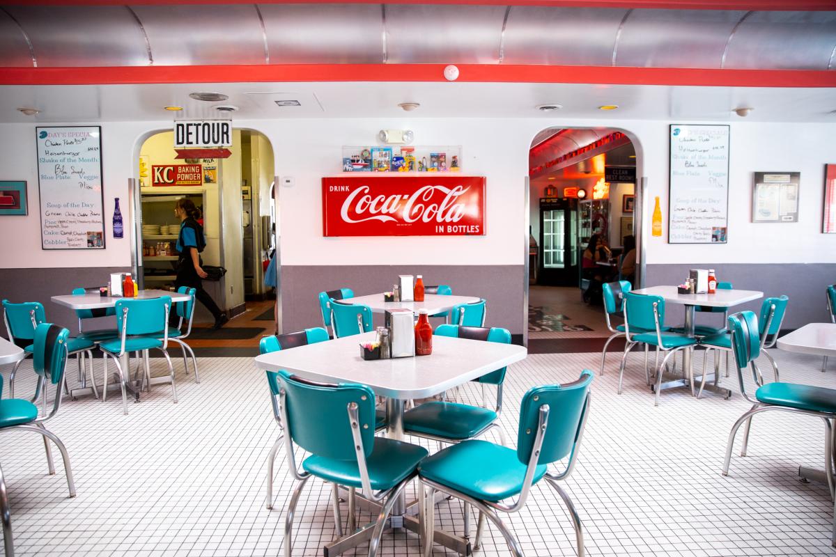 Interior of 66 Diner displaying old-timey looking tables and chairs.