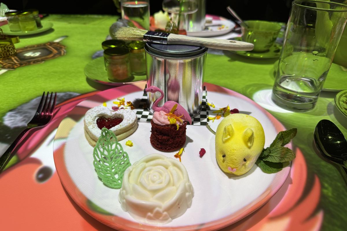 A plate of desserts during the Teatime in Wonderland sits on a table at Electric Playhouse.