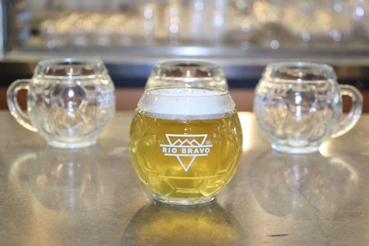 An image of three soccer ball glasses from Rio Bravo Brewing.