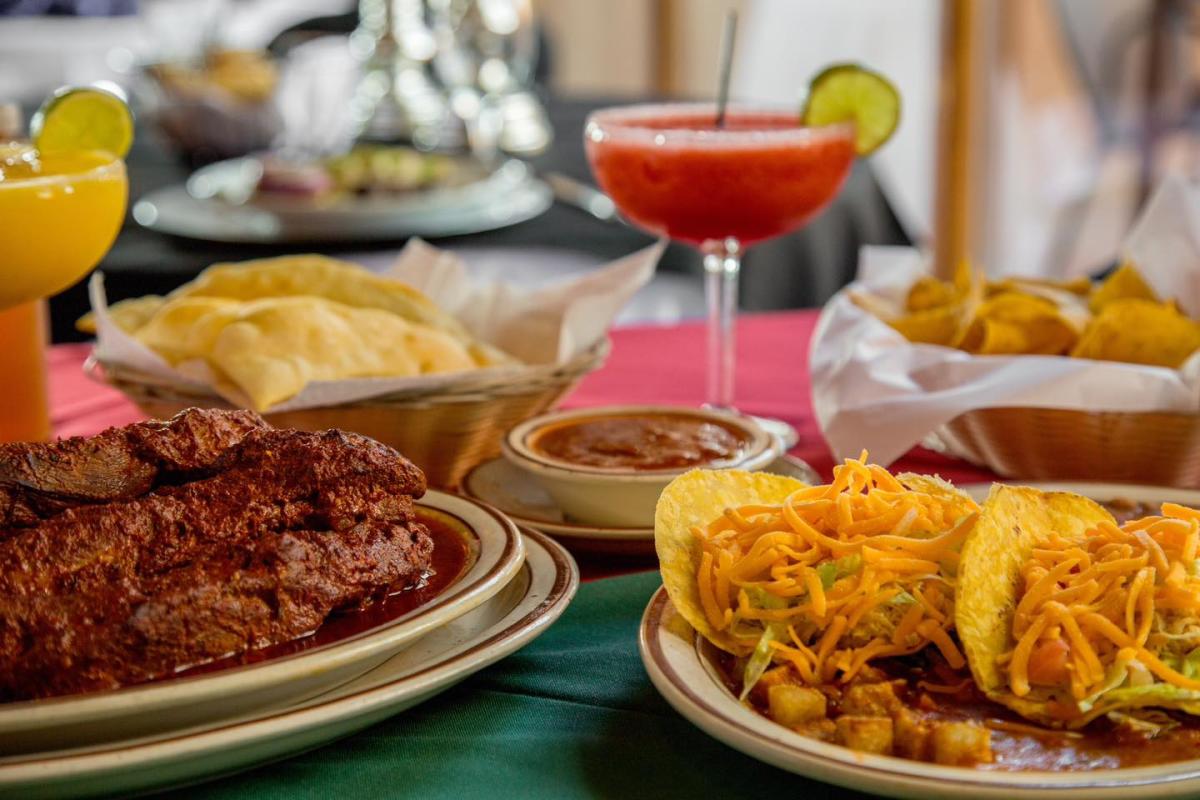 A table with tacos, ribs, chips and salsa, sopapillas and margaritas at Sadie's.