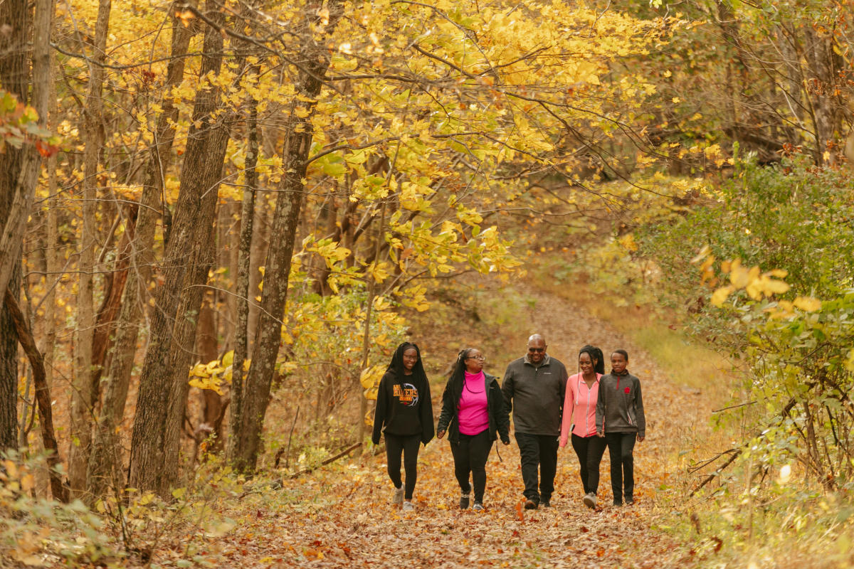 Family of five hiking in the fall.