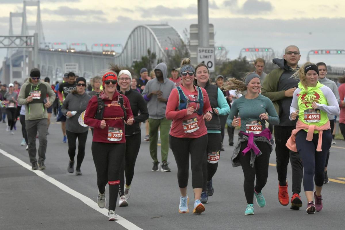 People walking across Chesapeake Bay bridge