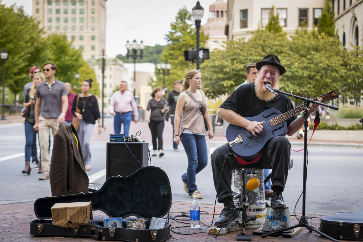 Busker with guitar - Pack Square area