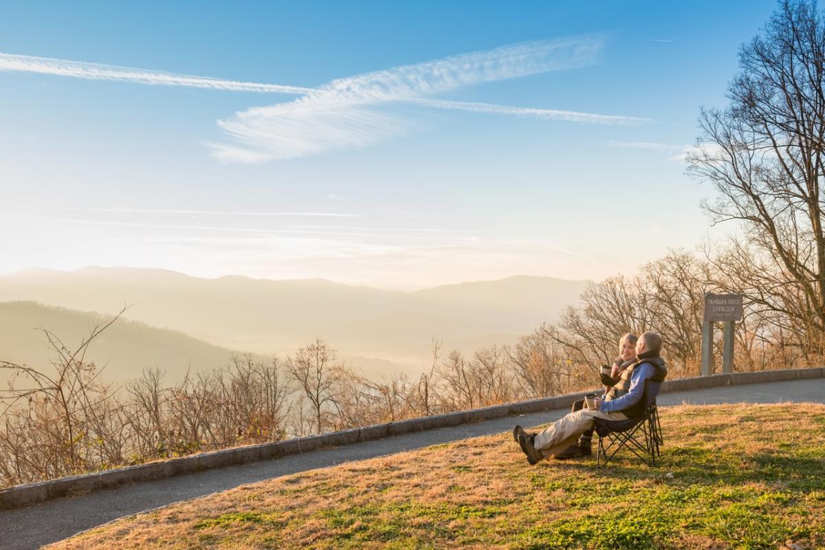 Couple sitting on blue ridge parkway in winter