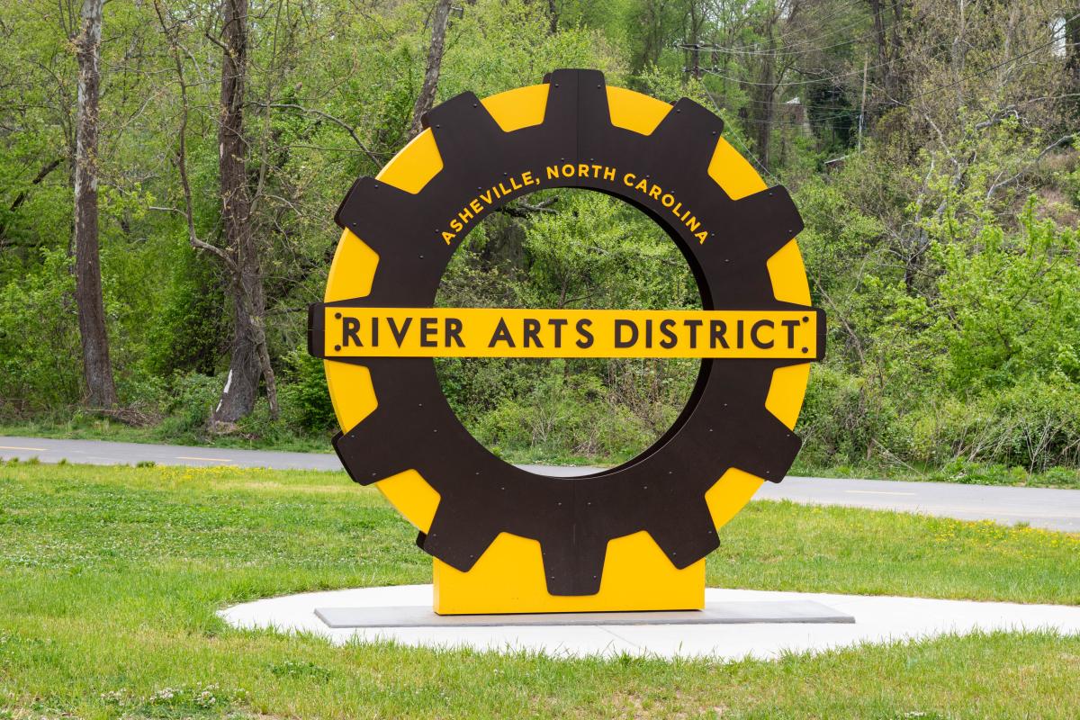 A sign welcomes visitors to the greenway in Asheville's River Arts District