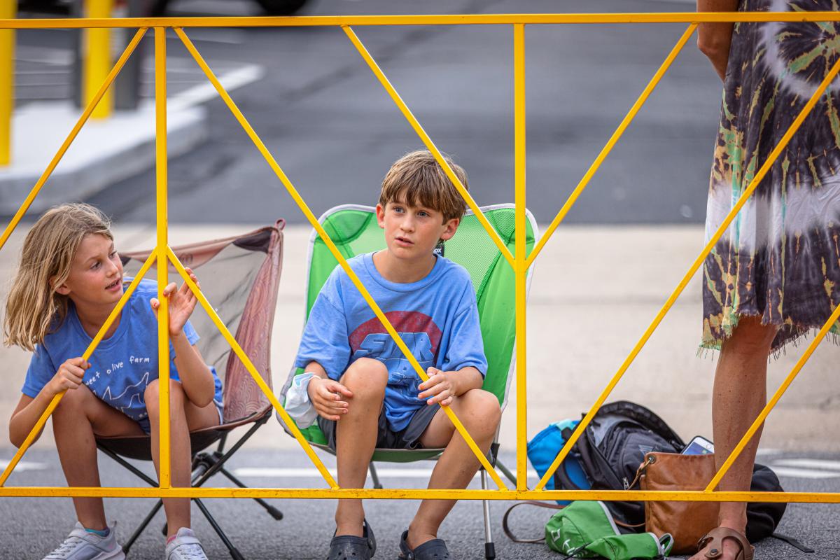 two kids watch the Twilight bike races