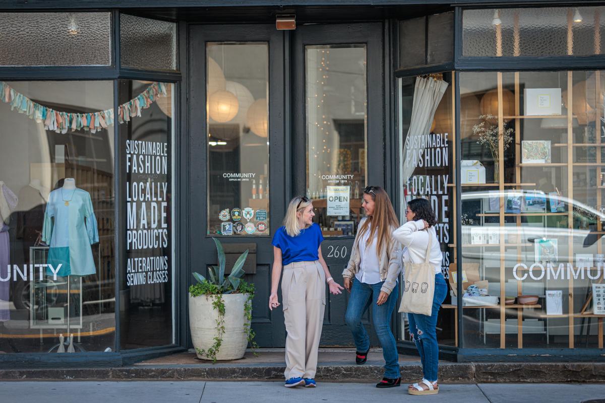 women outside community shopping