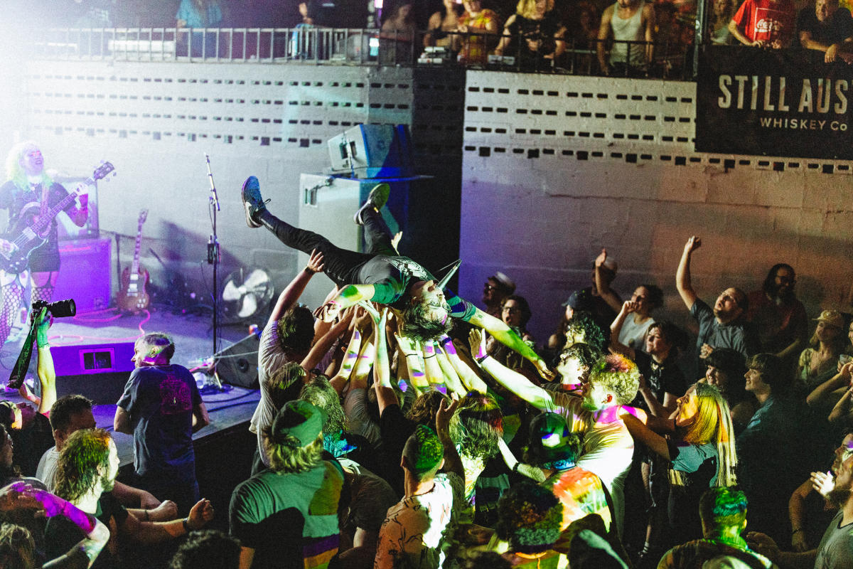 Image of a man crowdsurfing at Mohawk.