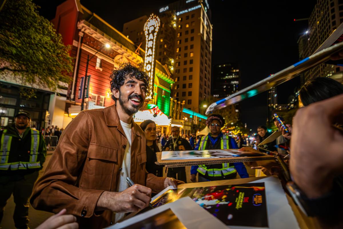 Dev Patel at signing autographs outside the Paramount Theater at the premiere of Monkey Man at SXSW 2024