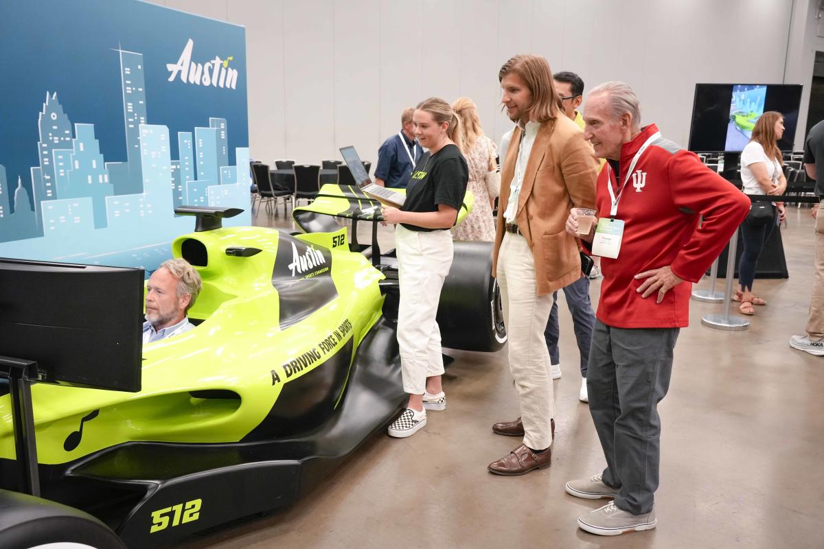 Image of the Austin Sports Commissions F1 Simulator in use at the ASCM Conference.